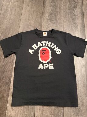 Bape Kids Black Tee with Red Ape Logo and White Lettering